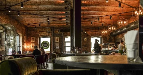 Time-lapse of life and movement in a dark expensive, chic cafe, bar Video stock 129598685