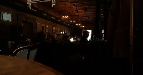 Time-lapse of life and movement in a dark expensive, chic cafe, bar Video stock 129598737