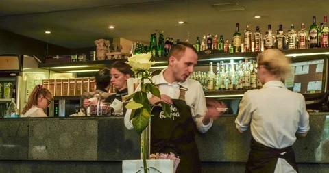 Time-lapse of life and movement in a dark expensive, chic cafe, bar Video stock 129598970