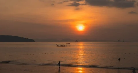 Time-lapse of light rays over the sea or ocean at sunset. Hot summer weather at Stock Footage 116419603