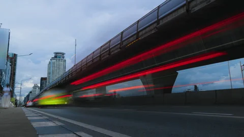 Time-lapse of light trails under an elevated highway in Bangkok Stock Footage 345981380