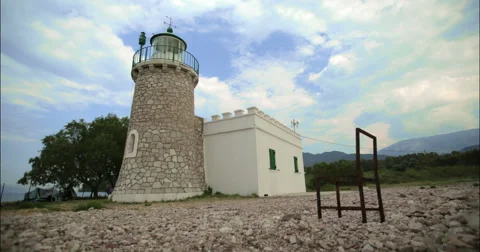 Time lapse with a lighthouse and a chair 4K Stock Footage 49152506