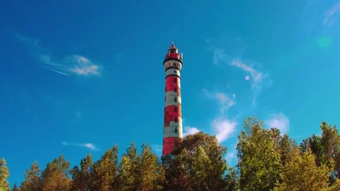Time-lapse of a lighthouse in a sunny day. Bright summer sky. 4k Stock Footage 133141647