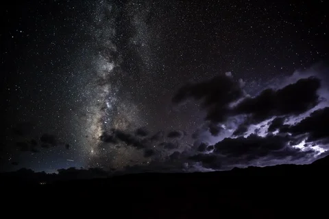 Time-lapse of lightning, dark sky and constellation of stars at night Stock Footage 104501865