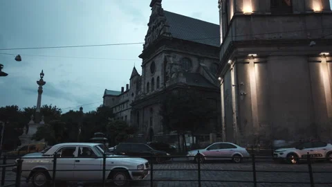 Time lapse of lights are lit on the facade of an old church Stock Footage 136131981