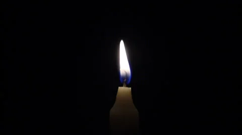 Time lapse of a lit candle while consuming, with black background Stock Footage 34929177