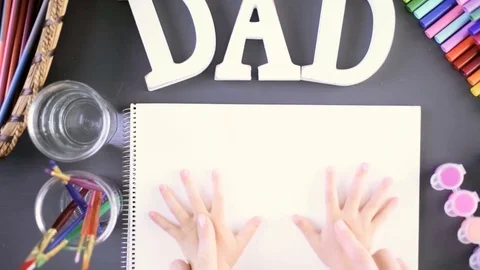 Time-lapse. Little girl tracing her hands for Father's Day card. Stock Footage