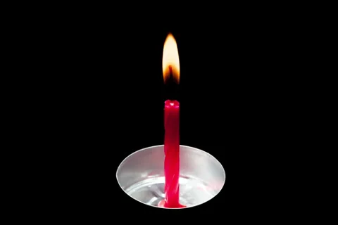 Time lapse of little red cake candle burning Stock Footage 36555911