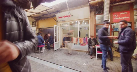 Time Lapse of Local Men Enjoying Traditional Tea Near The Citadel in Erbil, Iraq Stock Footage 150250952