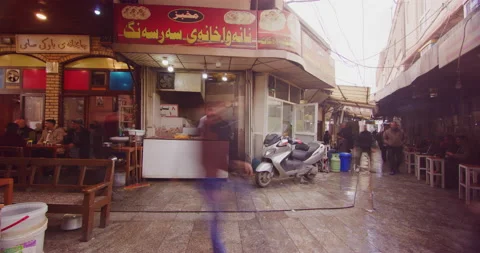 Time Lapse of Local Men Enjoying Traditional Tea And A Bakery in Erbil, Iraq Stock Footage 150251024