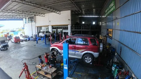 Time Lapse At Local Workshop For Car Service. Visible Noise Due To High ISO. Stock Footage 114430162