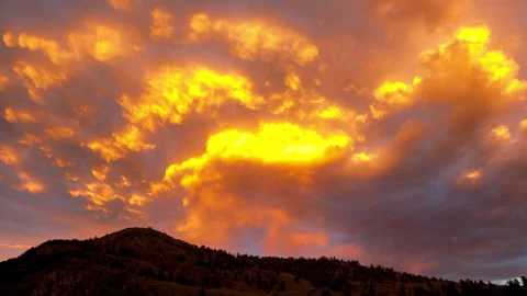 Time Lapse Lockdown Scenic View Of Orange Clouds Moving Over Mountains During Stock Footage 160327162