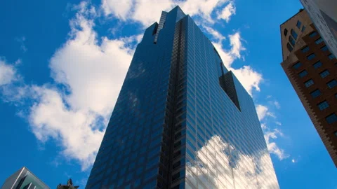 Time Lapse Lockdown Shot Of Tall Structure Against Blue Cloudy Sky In City Stock Footage 154797007