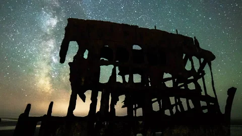 Time Lapse Lockdown Silhouette Of Shipwreck On Beach During Sparkling Stars In Stock Footage 160314865