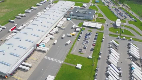 Time lapse Logistics park with warehouse, loading hub and many semi trucks .. Stock Footage 240430697