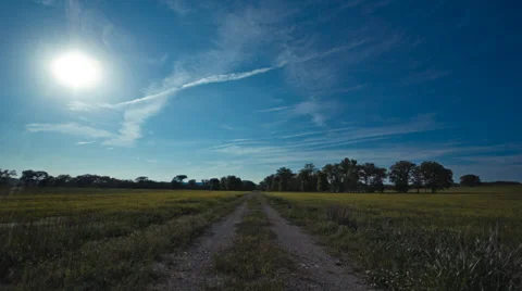Time Lapse -  Long Dirt Road Sunset Stock Footage 39557762