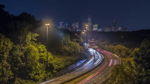 Time lapse long exposure of busy highway traffic in Toronto with buildings Stock Footage 91161776