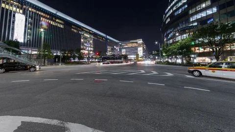 Time lapse of long exposure of car light trail and illuminated building, urban s Stock Footage 77054107