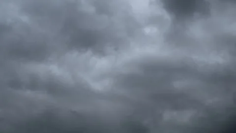 Time lapse looking up at churring storm clouds that fill the entire sky and fram Stock Footage 294256477