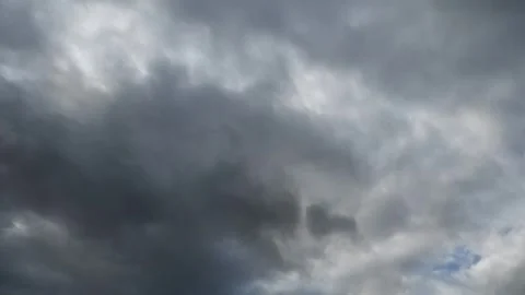 Time lapse looking up at grey storm clouds moving from left to right Stock Footage 287038050