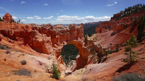 A Time-Lapse Looking Out Over A Natural Rock Arch Formation. Stock Footage 51751823