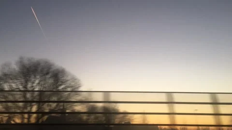 Time lapse of looking at sunset sky while driving on highway. Stock Footage 327972923