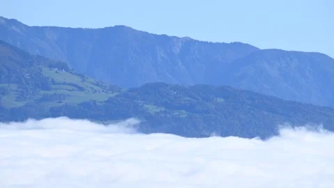 Time lapse of low altitude inversion clouds rolling in Ljubljana basin Stock Footage 140799979