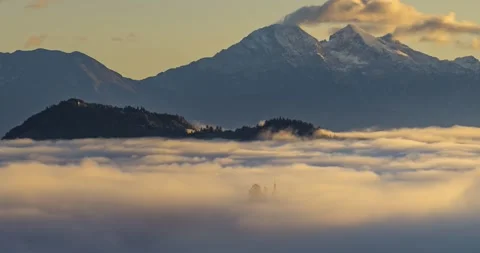 Time lapse low altitude inversion clouds rolling in Alpine valley, Slovenia Stock Footage 141714287
