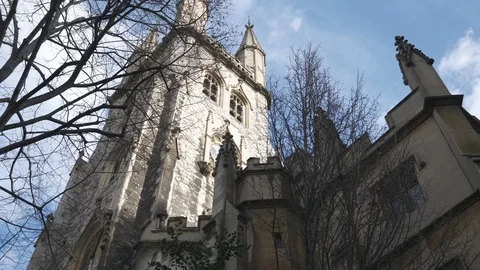 Time lapse. A low angle view of a church with an old tower. Stock Footage 104267668