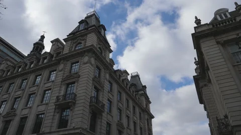 Time lapse. A low angle view of clouds moving over a historic building. Stock Footage 200786073
