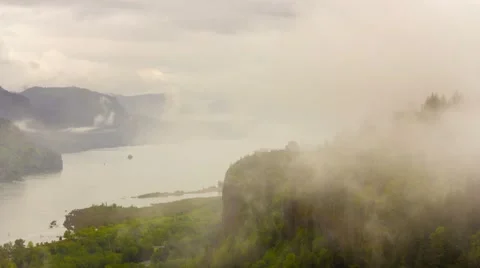 Time lapse of low clouds and fog along Columbia River Gorge in Portland Oregon Stock Footage 62494423
