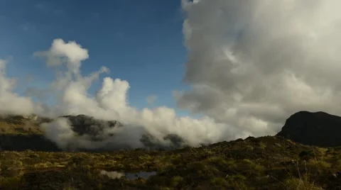 Time lapse of low clouds moving over mountaintop, Nevado del Ruiz, Colombia Stock Footage 63296370