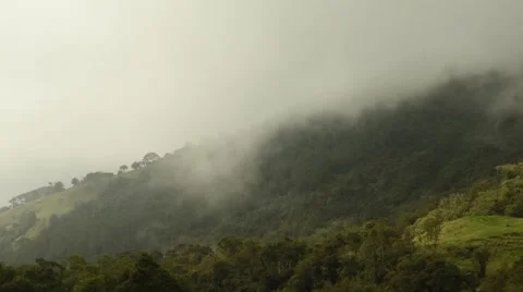 Time lapse of low clouds moving over mountain Stock Footage 63303719