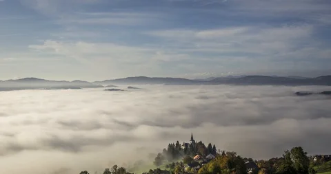 Time lapse low clouds rolling in valley Stock Footage 118394559