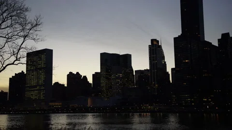 Time lapse of lower Manhattan sunset from Roosevelt Island. Stock Footage 60912989