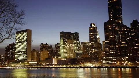 Time lapse of lower Manhattan sunset from Roosevelt Island. Stock Footage 60912999