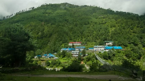 Time lapse of lush mountain and houses in Phakding, Nepal Stock Footage 62388957