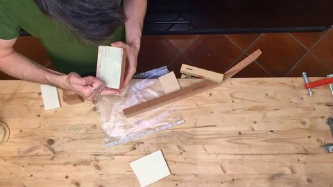 Time lapse of Luthier making guitar neck, close up Video stock 113064530