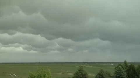 Time Lapse of Mammatus Clouds and Virga on Plains Stock Footage 54752732