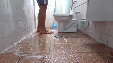 Time lapse of a man cleaning a bathroom n brazil Stock Footage 130980501
