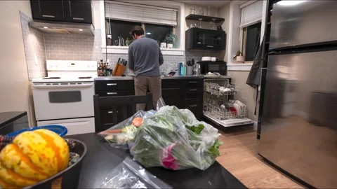 Time lapse of man cleaning kitchen Stock Footage 221390847