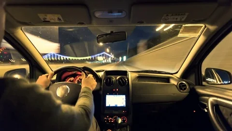 Time lapse. Man driving car in the evening. Wide angle shot. Stock Footage 79802179