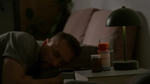 Time Lapse of Man Having Anxious Sleep and Turning in Bed after Medication Stock Footage 314839150