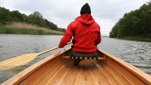 Time lapse of man paddling canoe on the lake Stock Footage 131295085
