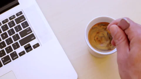 Time lapse: Man prepares his coffee and works on his laptop. Top view Stock Footage 134625213