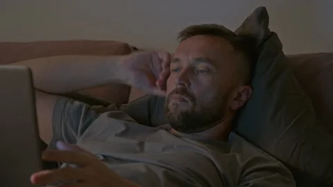Time Lapse of Man Stressed by Project Deadline Working on Laptop in Bed Stock Footage 314839953