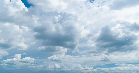 Time lapse of many raining cumulus clouds Stock Footage 123745375