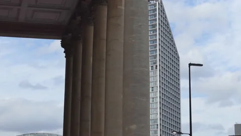 Time lapse. Massive columns and moving clouds in the background. Stock Footage 114516070
