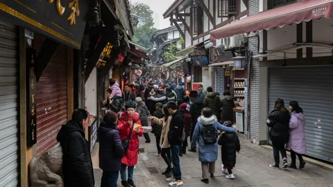 Time lapse of massive tourists and locals on street at Ciqikou, Chongqing Stock Footage 124444935