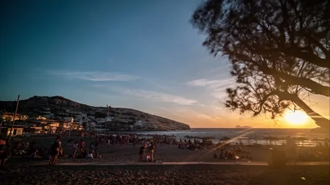 Time lapse at Matala beach in Crete with tree silouette and mountains Stock Footage 261062192